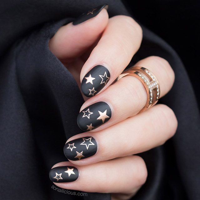 black and gold star nails